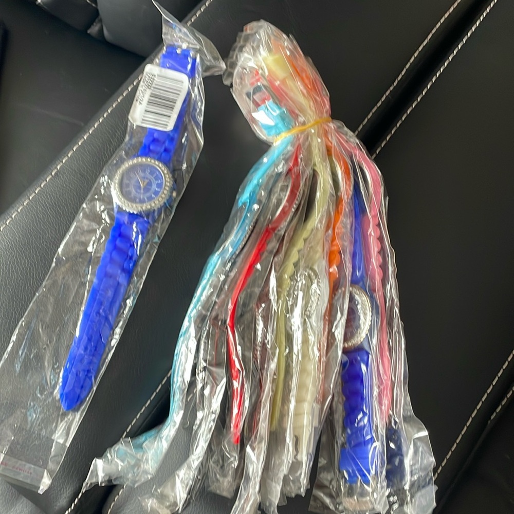 Multi colors watches never opened, needs batteries